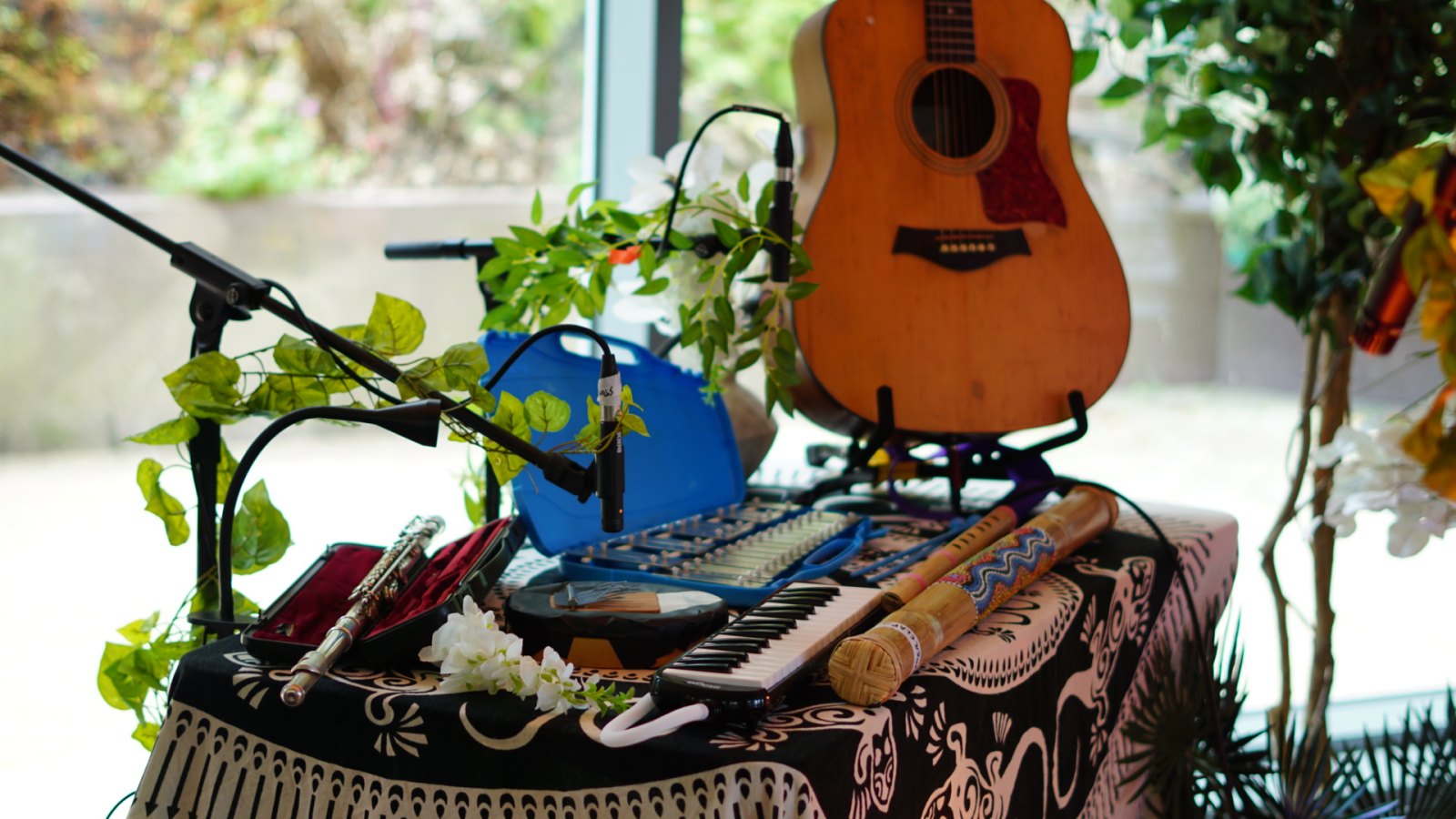 The instrument table: keyboard, whistles, small percussion and a guitar.